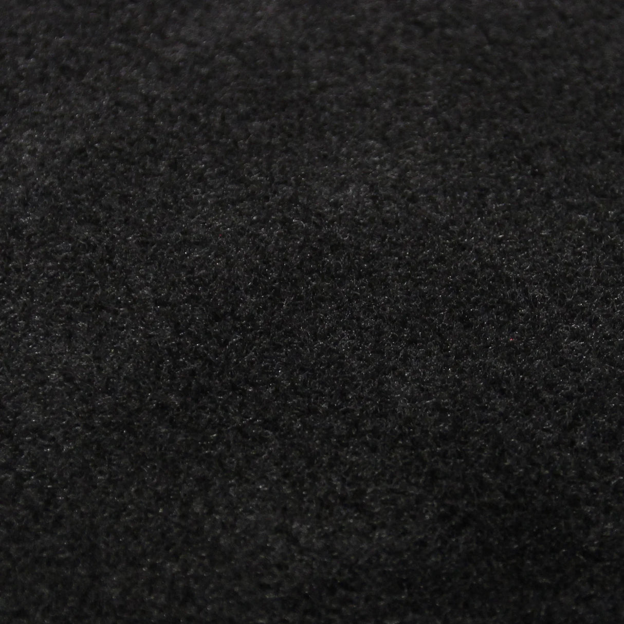 Soft black van carpet lining showcasing a plush texture, ideal for vehicle interiors, accompanied by five adhesive cans for easy installation