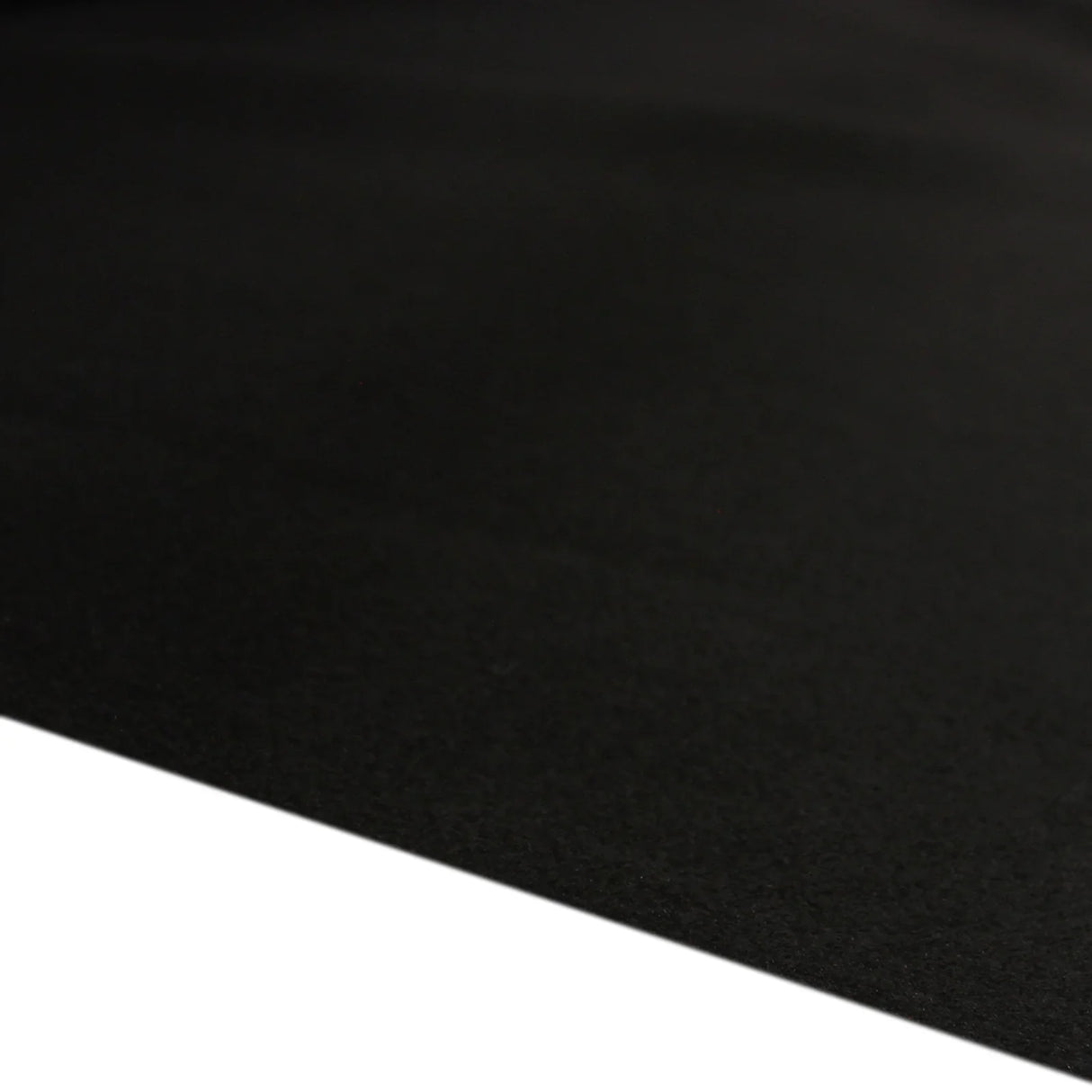 Black van lining material with a smooth texture, ideal for camper kitchen installations, showcasing durability and...