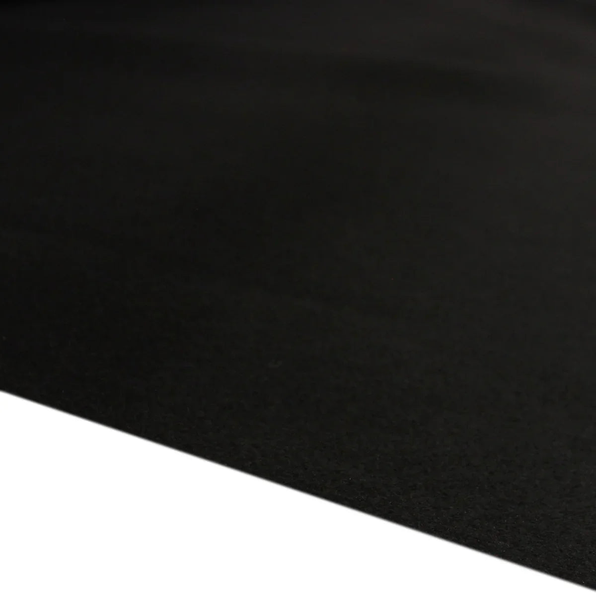 Textured black van lining material, ideal for VW Caddy, showcasing a smooth finish and durable quality for vehicle interiors