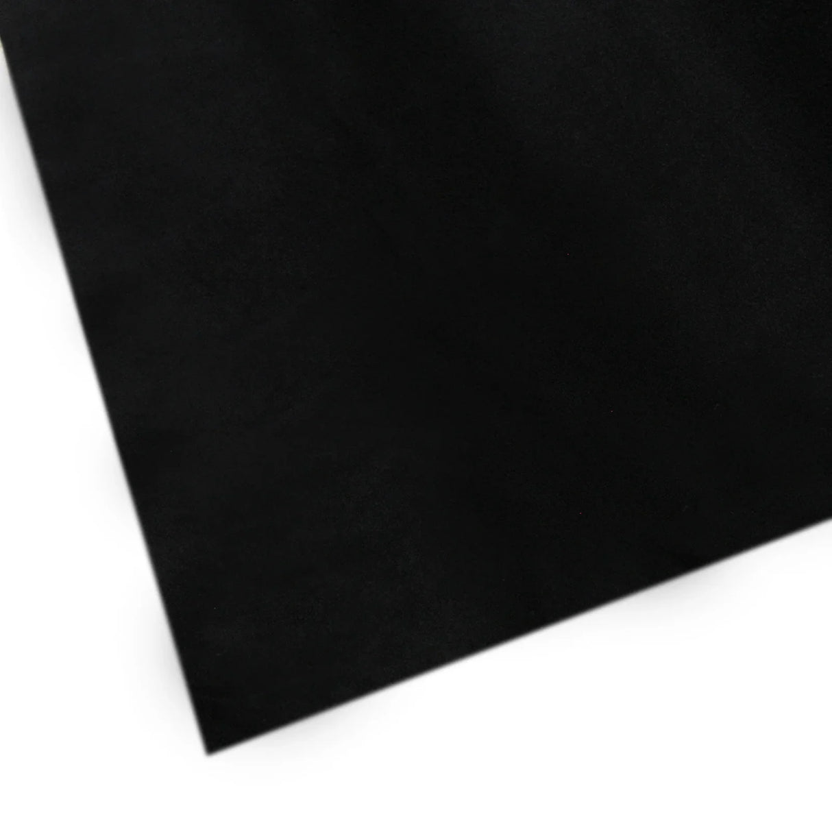 Black van carpet lining with a smooth texture, showcasing a corner edge, accompanied by five adhesive cans for easy installation