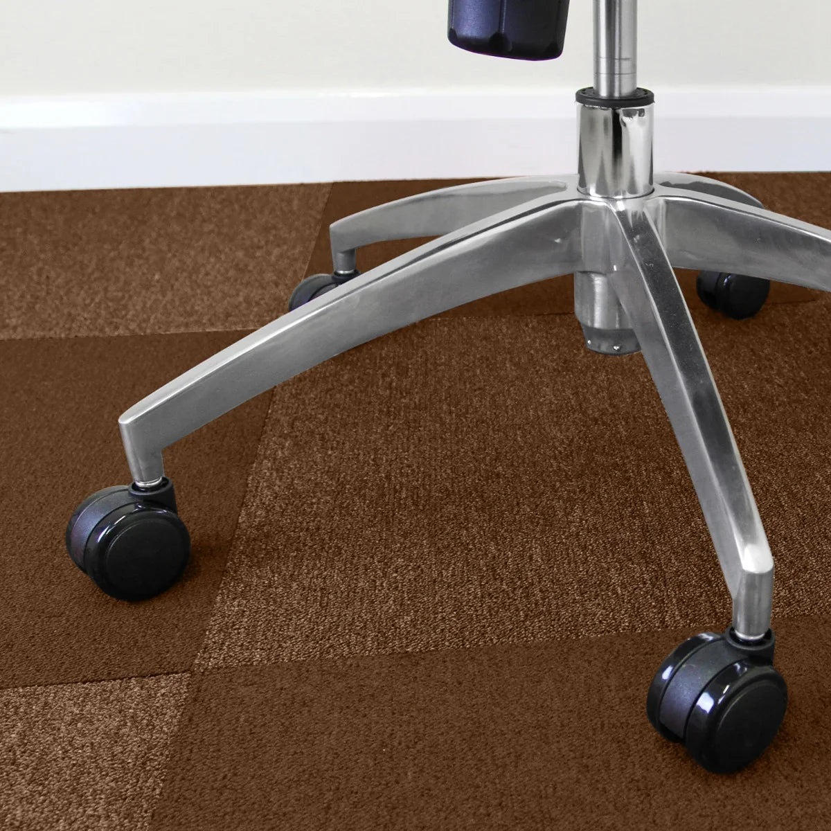 Brown carpet tiles arranged in a checkerboard pattern, showcasing a soft texture, ideal for office spaces and home decor