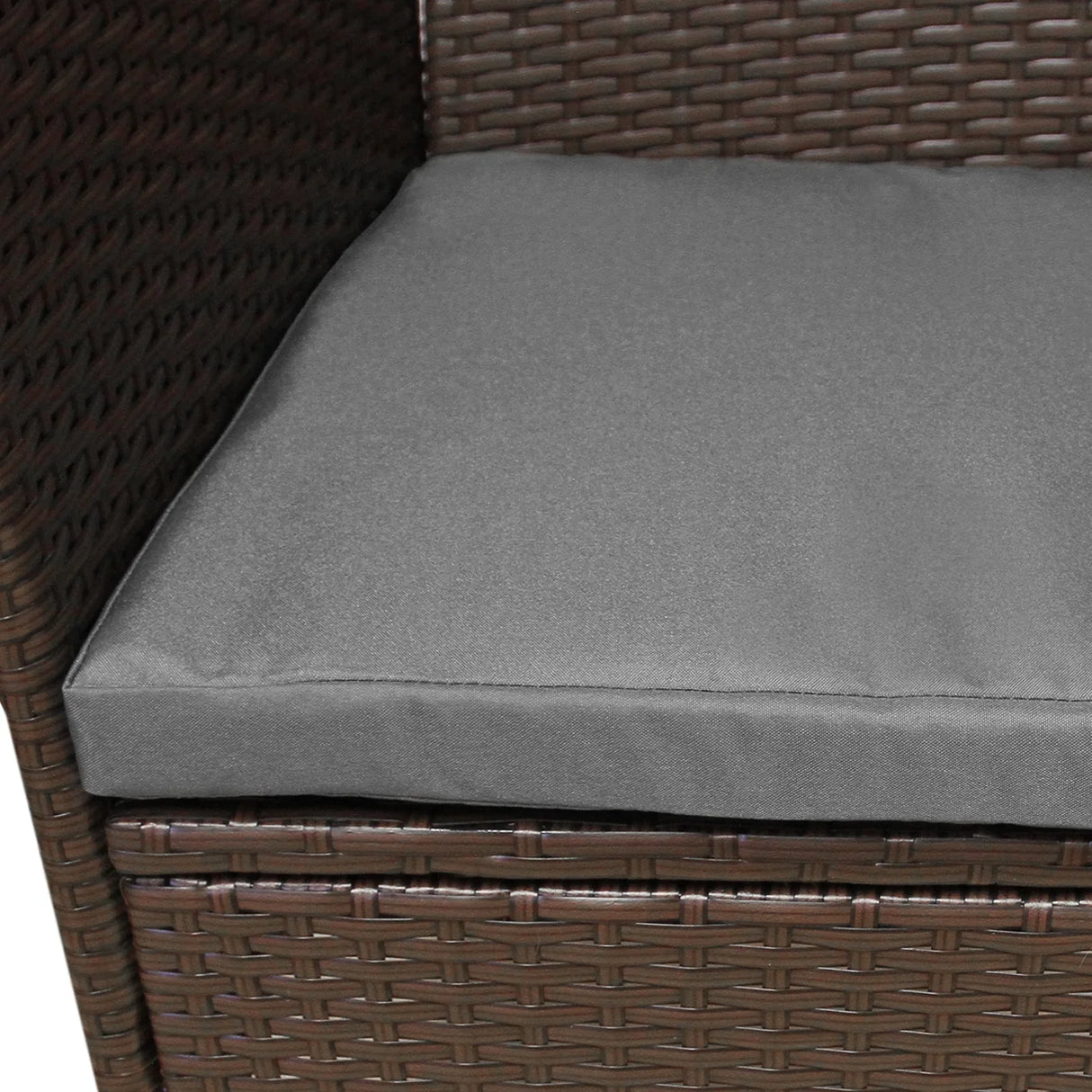 Brown rattan bistro set featuring a plush gray cushion, showcasing a woven texture and sturdy construction for outdoor dining