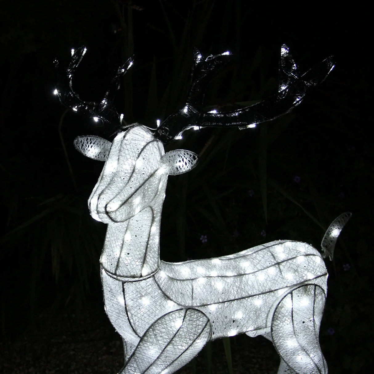 Large light-up stag reindeer with a shimmering white mesh body and glowing LED lights, perfect for festive outdoor decor