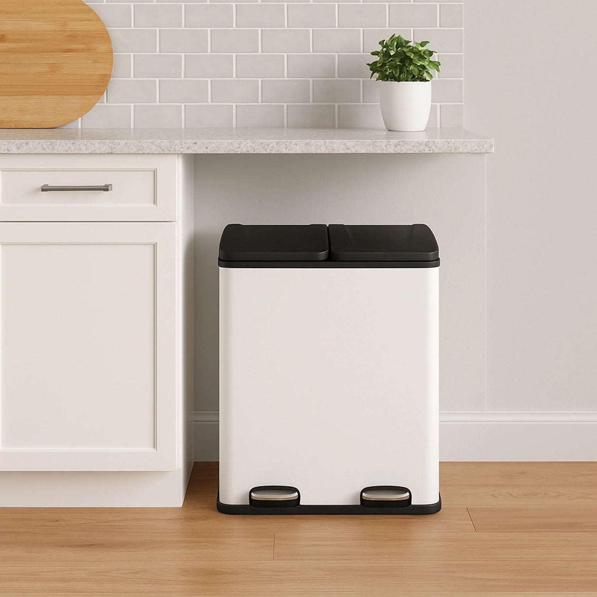 60L dual pedal bin in sleek white with black lid, positioned beside a kitchen counter, featuring a modern, minimalist design