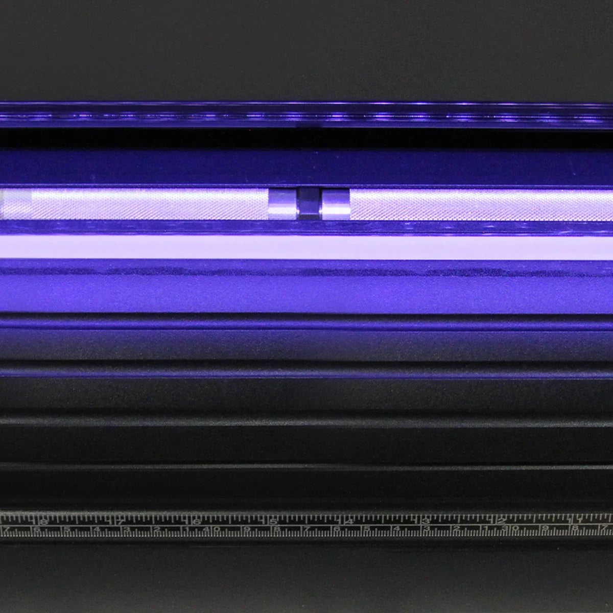 Close-up of the 720 Vinyl Cutter's LED light guide, showcasing its sleek design and vibrant purple illumination for precision cutting