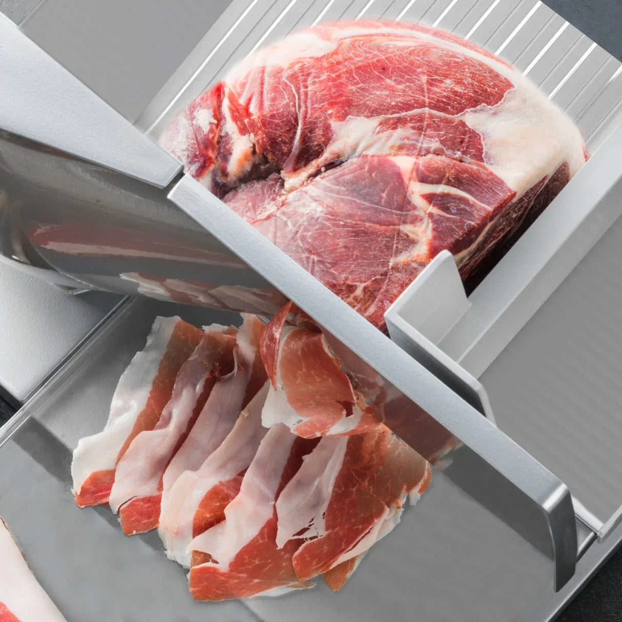 12-inch KuKoo meat slicer with stainless steel blade, slicing through marbled meat, showcasing thin, even slices on a...