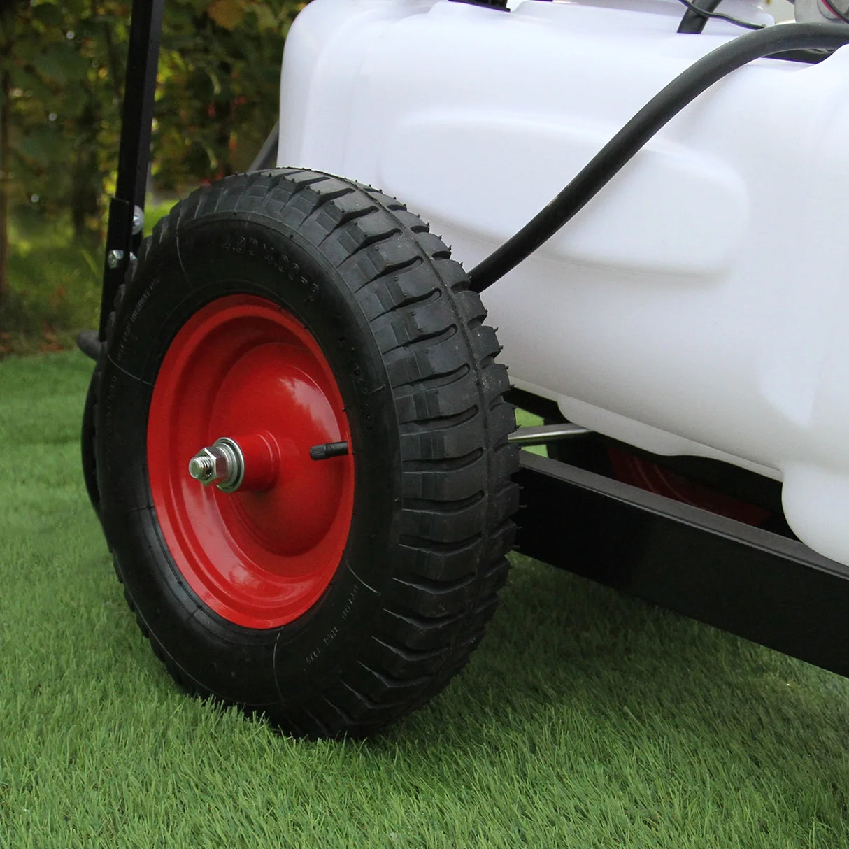 60L ATV trailer and sprayer featuring a sturdy black frame, red wheel, and white tank, designed for durability and efficient spraying