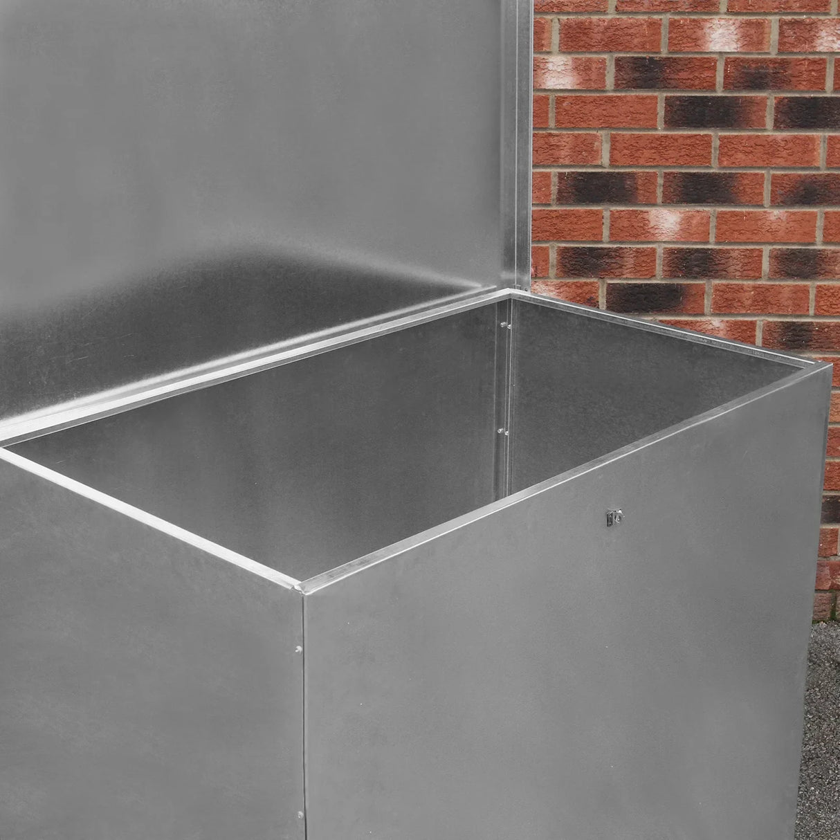 Galvanised feed store with a single compartment, featuring a shiny metal finish and a spacious interior for storage