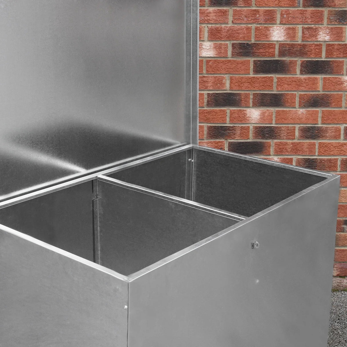 Galvanised feed store with two compartments, featuring a sleek metallic finish and sturdy construction, ideal for organizing animal feed