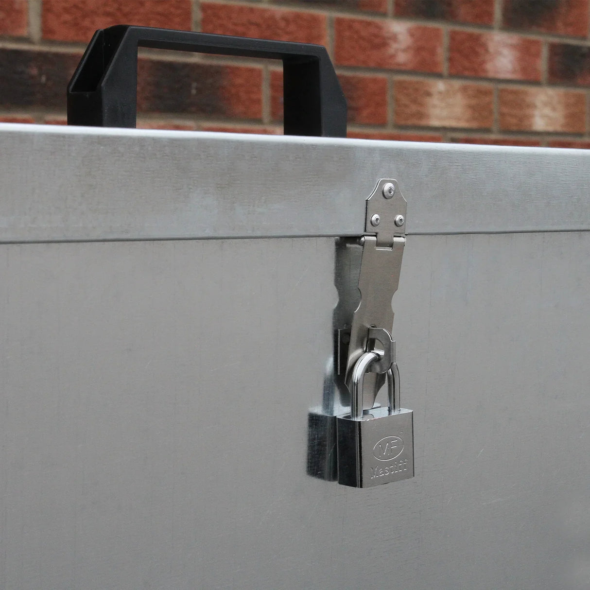 Galvanised feed store with three compartments, featuring a sturdy metal exterior, secure latch, and a lock for safety