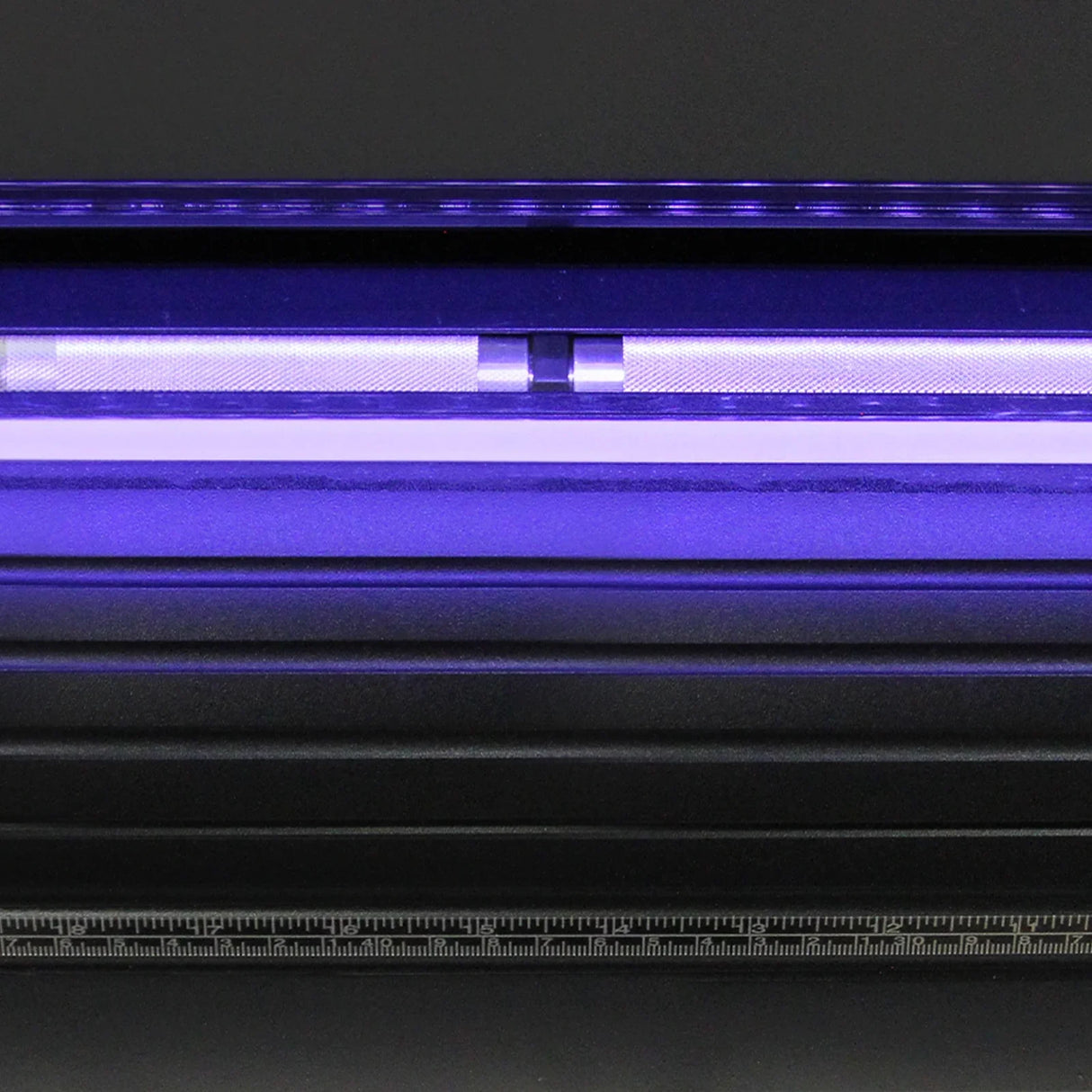 Close-up of the 1350 Vinyl Cutter's LED light guide, showcasing the sleek black design and illuminated cutting area