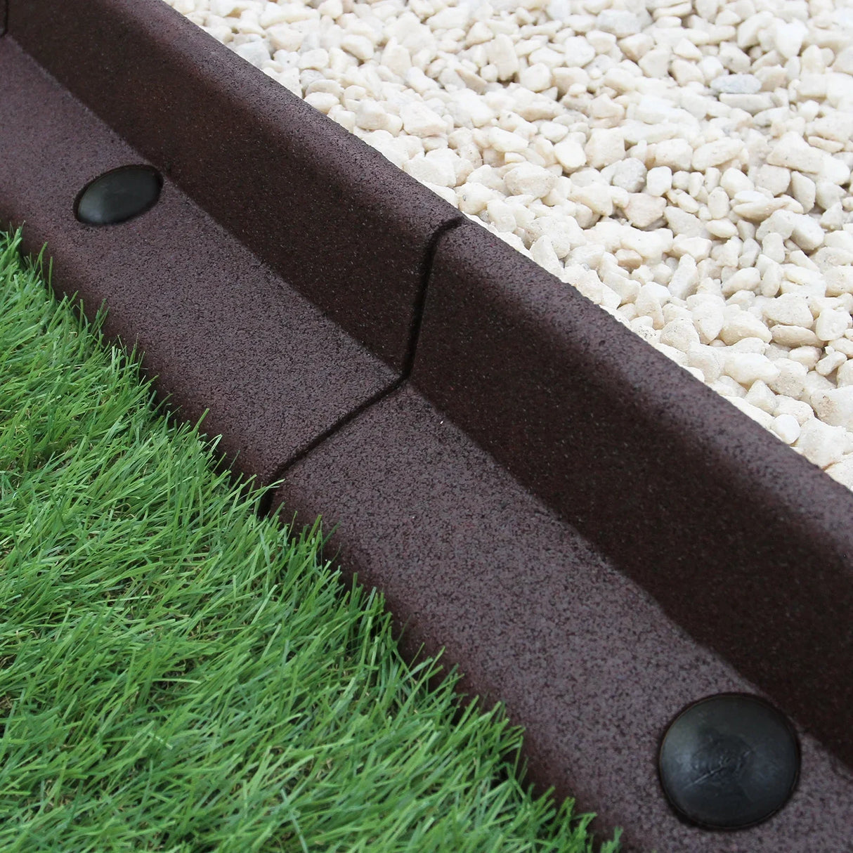 Flexible brown lawn edging, 1.2m long, featuring a textured surface, curved shape, and secure connectors, ideal for garden borders