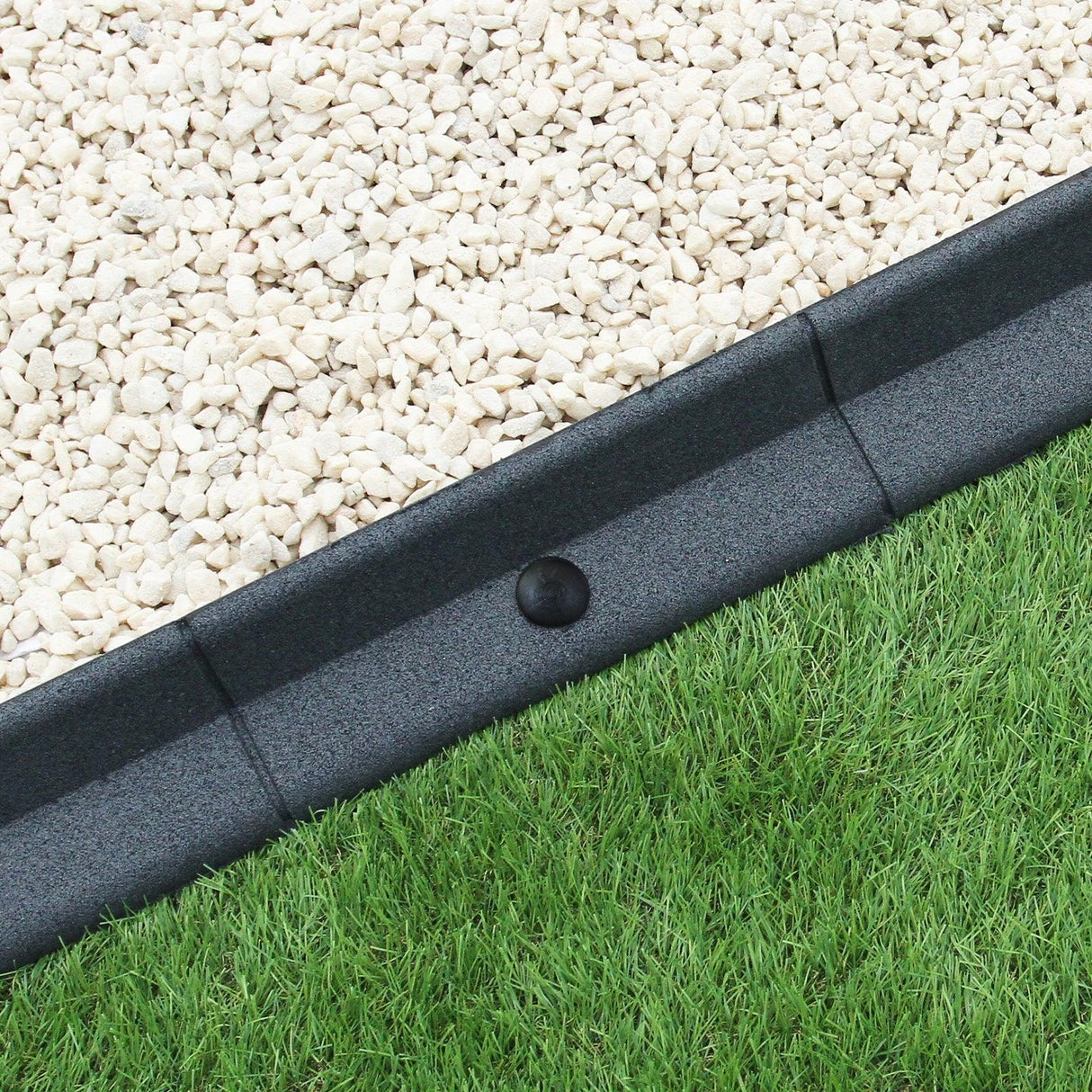 Flexible lawn edging in grey, 1.2m long, featuring a smooth texture, designed to separate grass from gravel for a tidy garden look