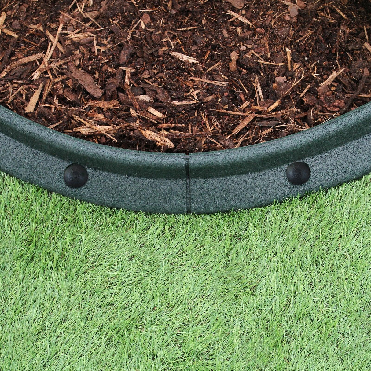 Flexible green lawn edging, 1.2m long, featuring a smooth, curved design with sturdy connectors, ideal for garden borders and landscaping