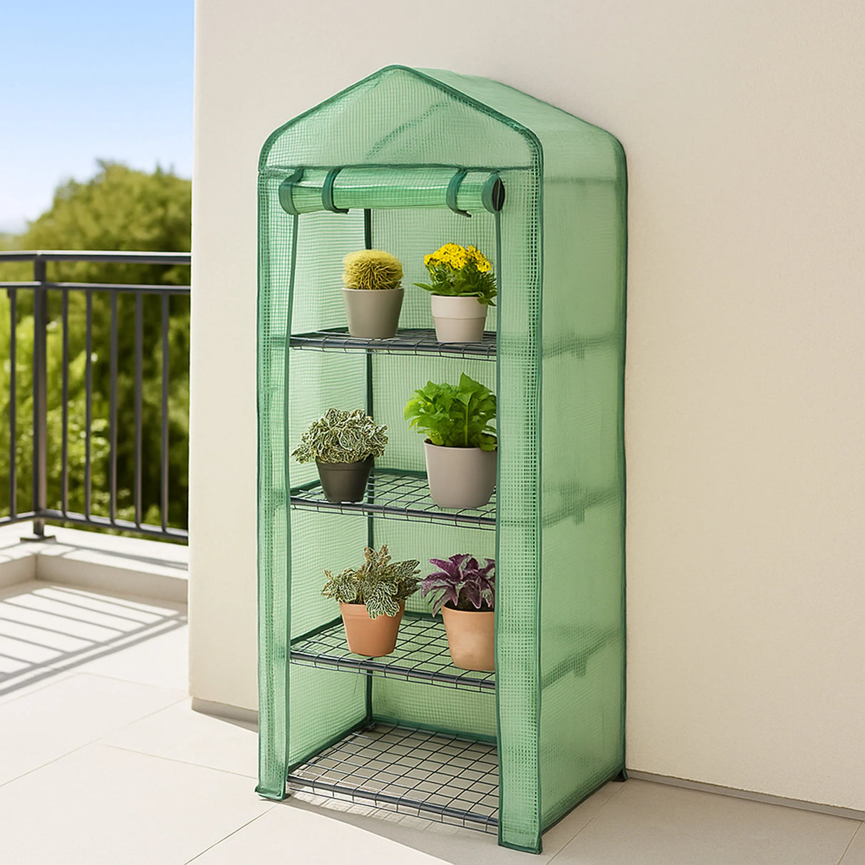 4-tier greenhouse with a green PE cover, featuring potted plants on wire shelves, ideal for small outdoor spaces and gardening