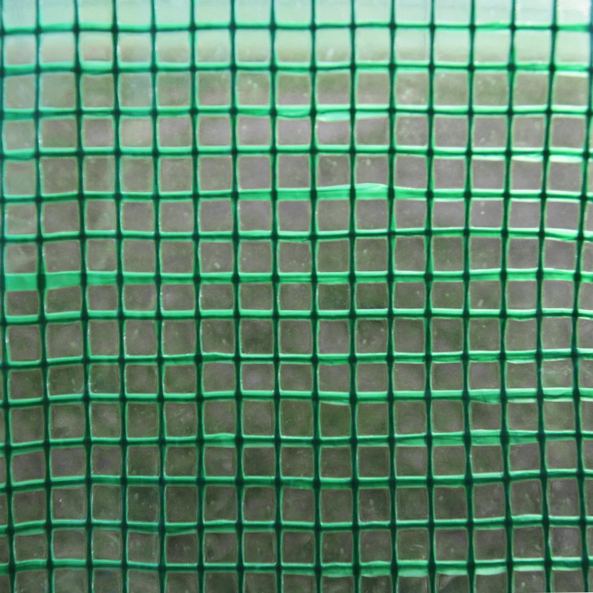 Green mesh fabric with a grid pattern, showcasing the durable material used for the Polytunnel 19mm 4m x 2m greenhouse structure