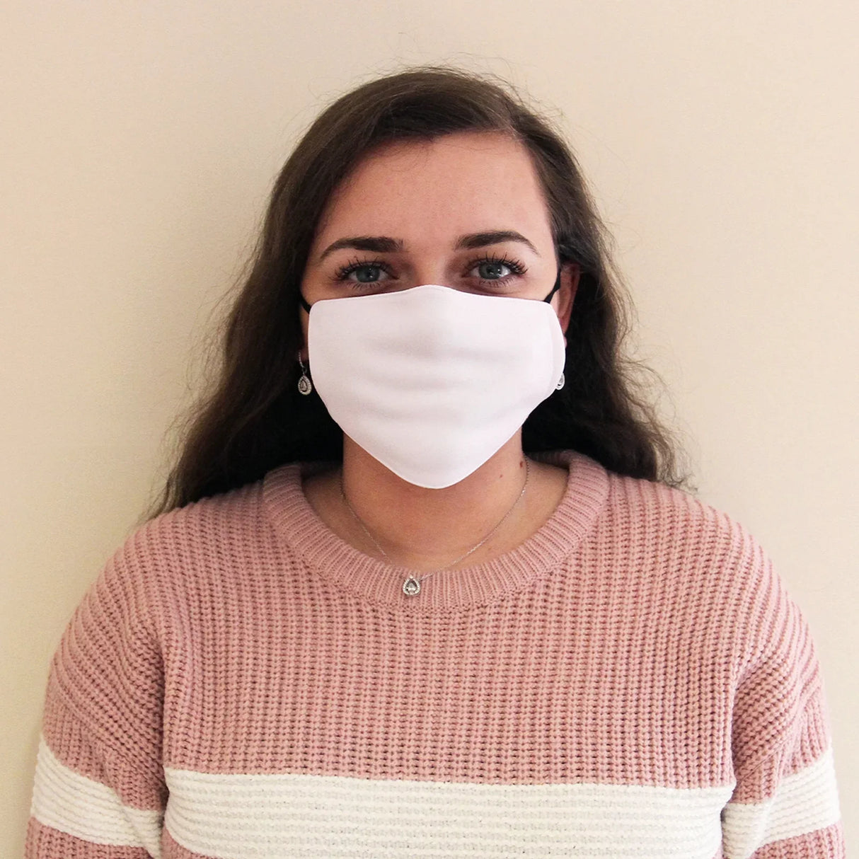 White sublimation face mask worn by a model, showcasing a smooth fabric texture, ideal for custom designs and personal use