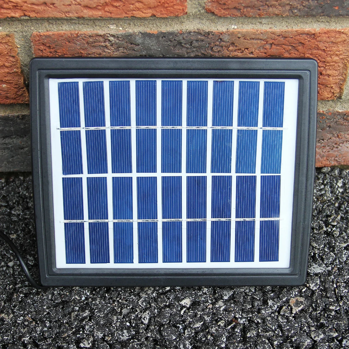 Solar panel for round ball water feature, featuring a sleek black frame and multiple blue solar cells for efficient energy capture