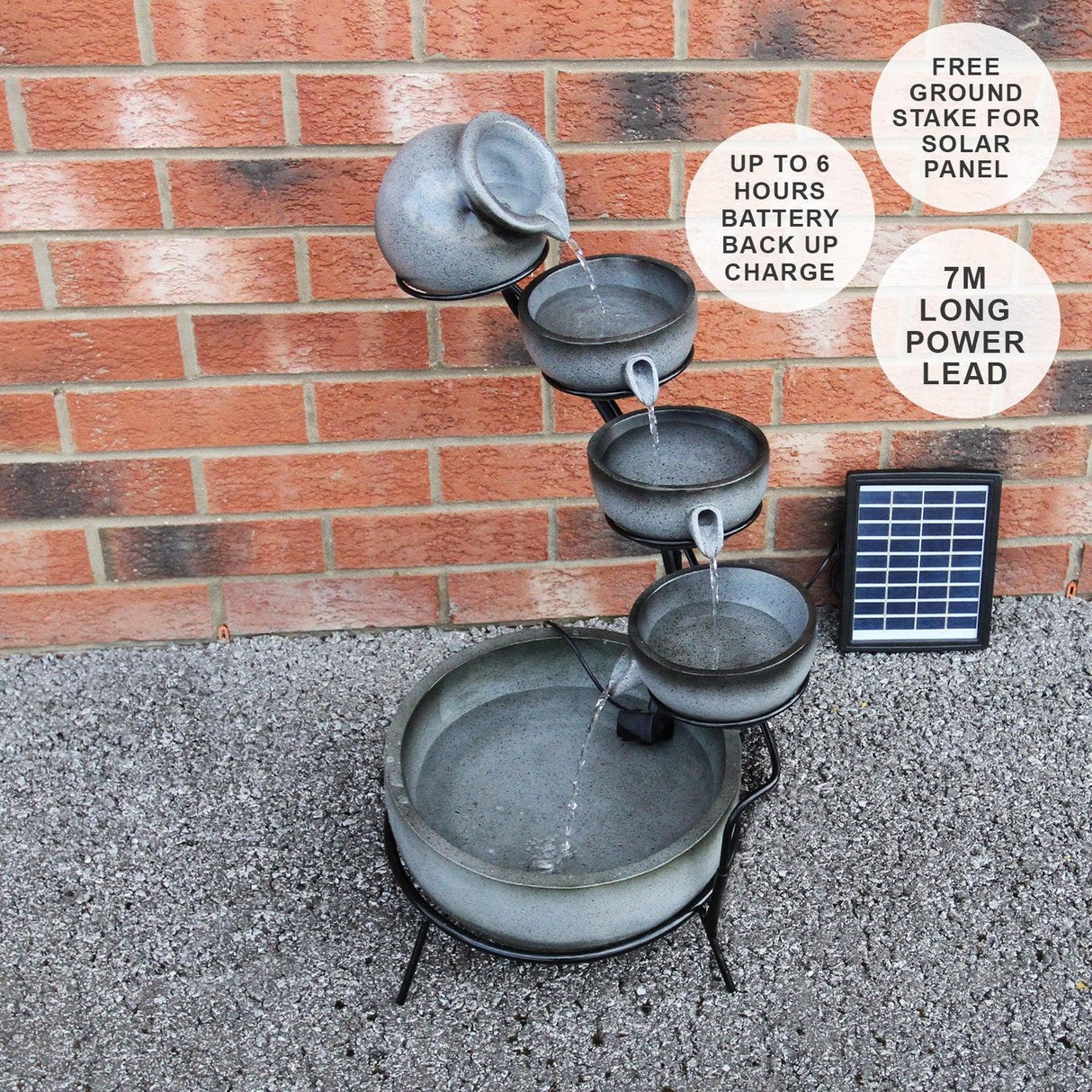 Grey 4 tier spilling bowls water feature with a solar panel, showcasing textured bowls cascading water into a round basin