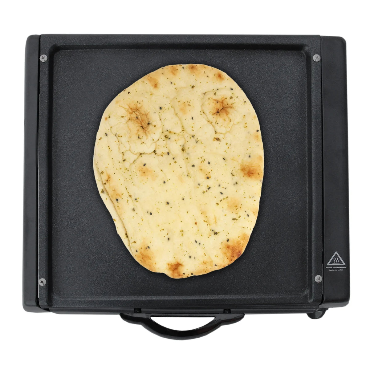 Black mini tandoor oven with a round, golden-brown naan bread resting on its smooth cooking surface, showcasing even texture and grill marks