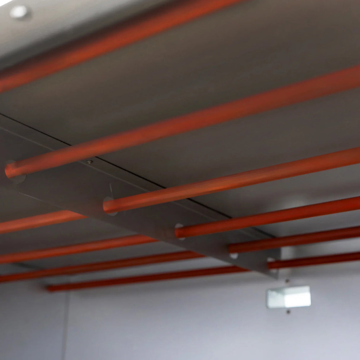 Interior view of the KuKoo large commercial pizza oven showcasing sturdy metal racks with orange support bars for baking trays
