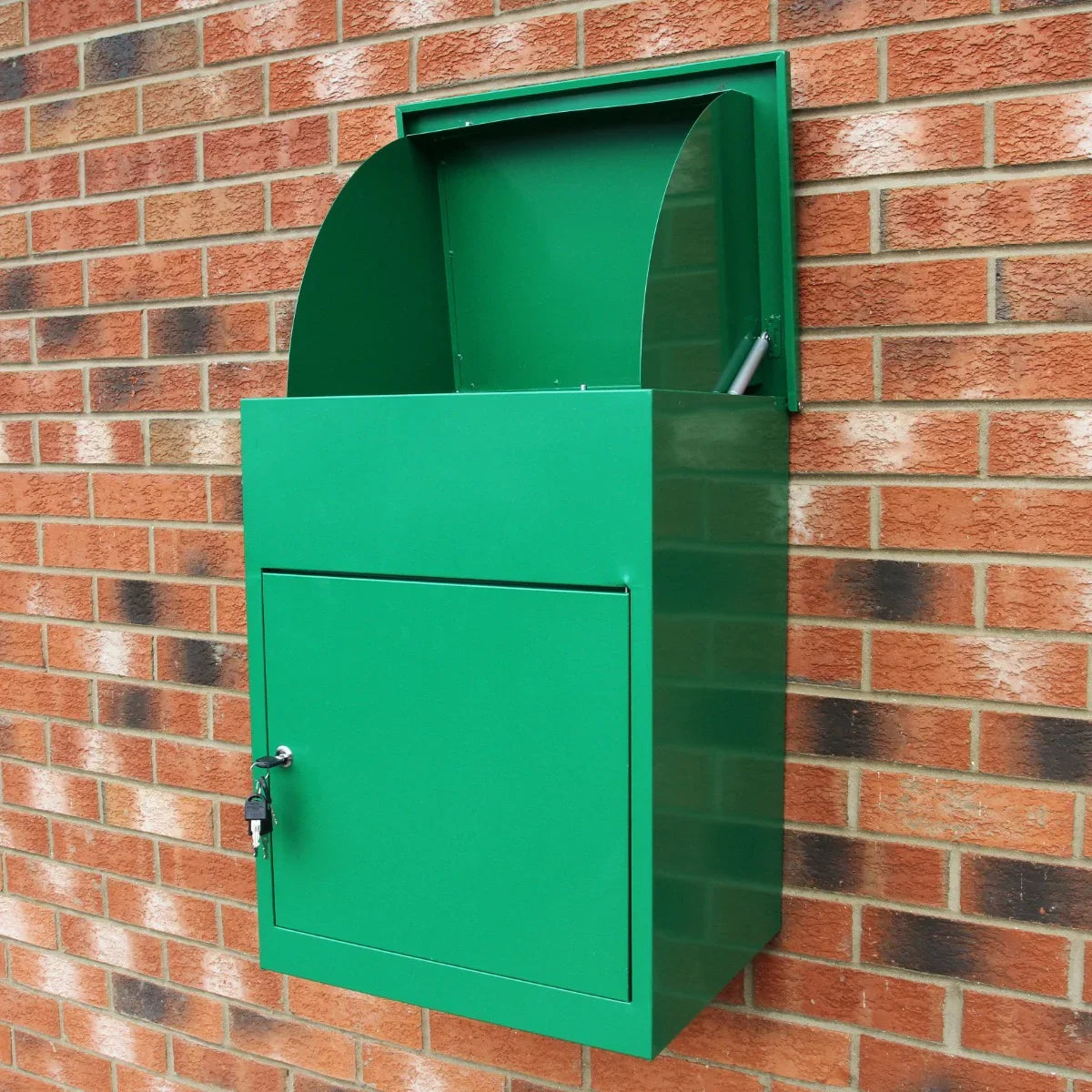 Bright green parcel post box mounted on a brick wall, featuring a curved top, secure lock, and a spacious drop slot for packages