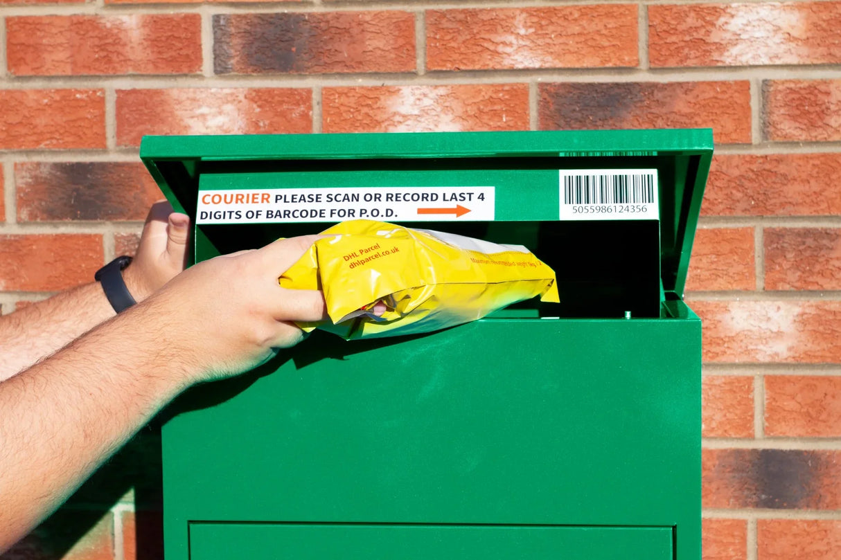 Bright green parcel post box with a hand inserting a yellow package, featuring a barcode and instructions on the lid