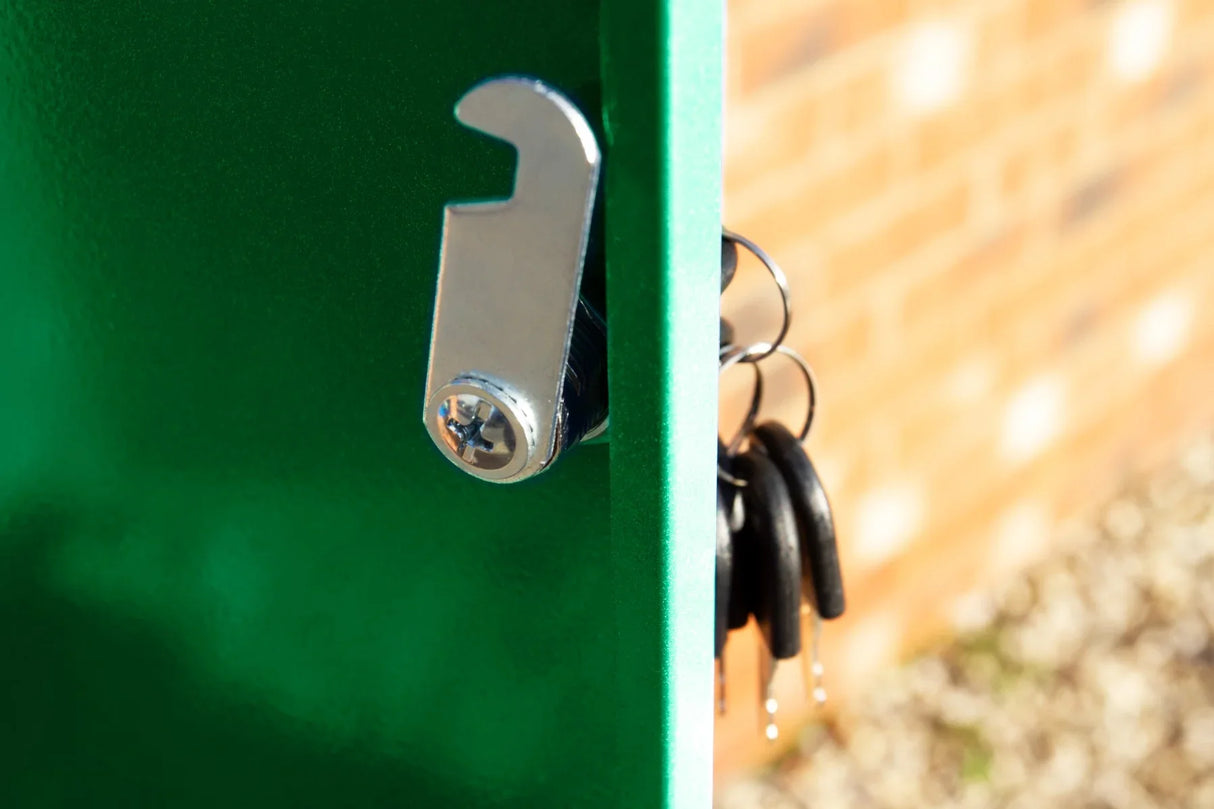 Close-up of a green parcel post box with a shiny metal lock and attached keys, showcasing its durable design and secure features