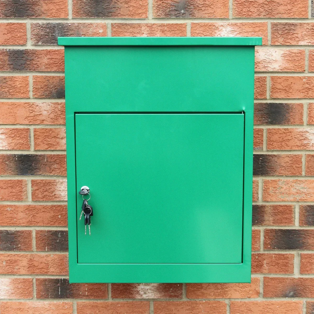 Bright green parcel post box with a smooth finish, mounted on a brick wall, featuring a secure key lock and a sleek design