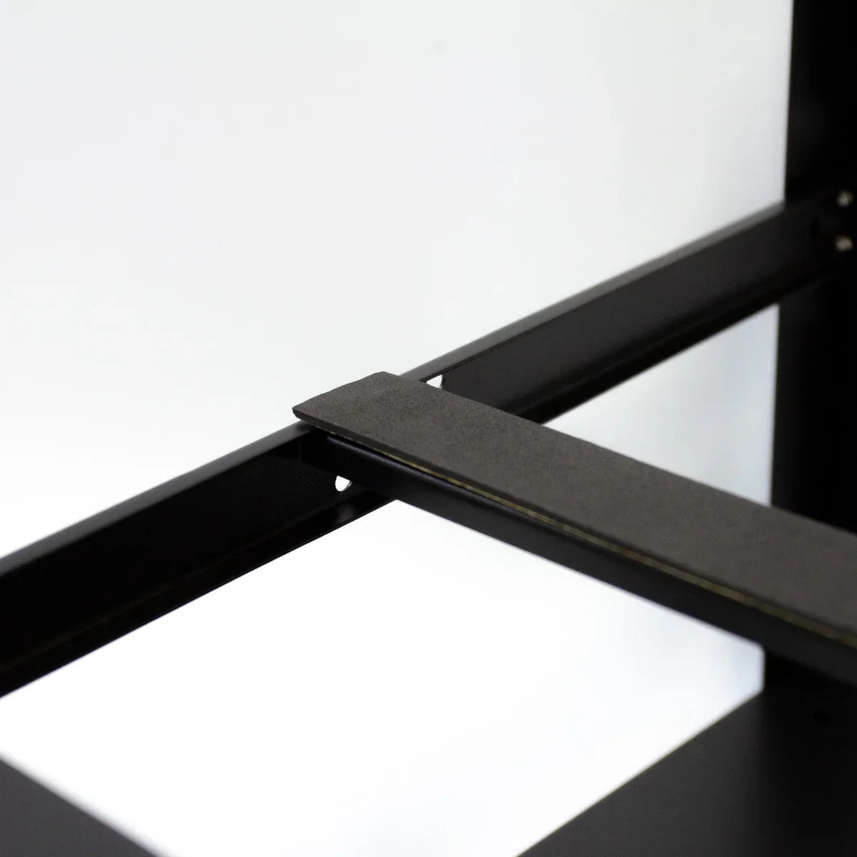 Black metal frame detail for a 6-8 GPU mining rig, showcasing sturdy construction and precise alignment for optimal performance
