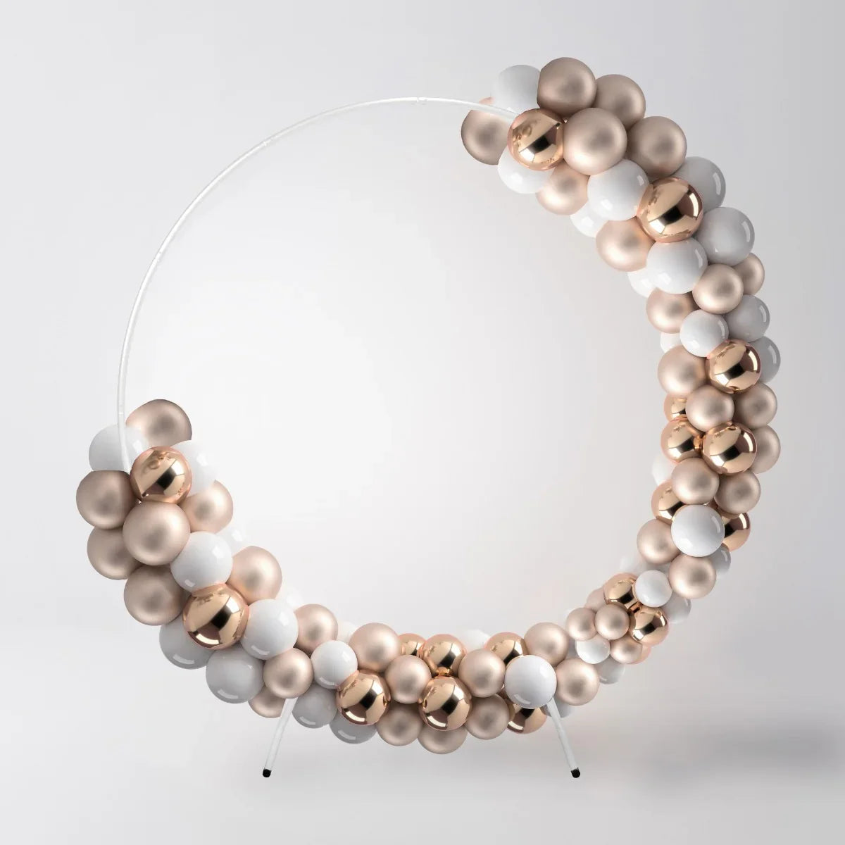 Elegant white wedding moongate with a circular design, adorned with glossy white, rose gold, and champagne-colored balloons