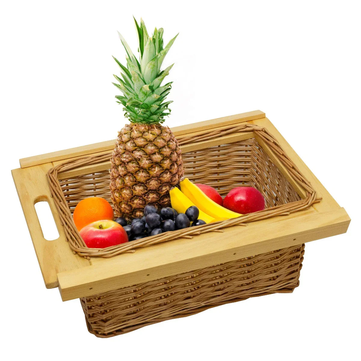 Pull out wicker kitchen basket with wooden handles, filled with fresh fruits including a pineapple, apples, bananas, and oranges