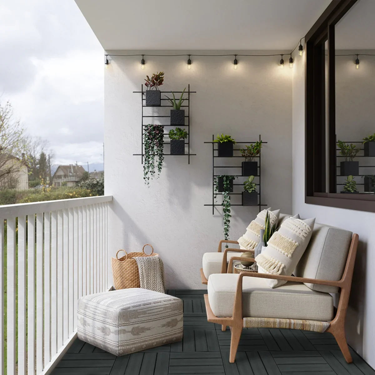 Grey 30x30cm WPC decking floor tiles arranged on a stylish balcony, complemented by potted plants and cozy seating