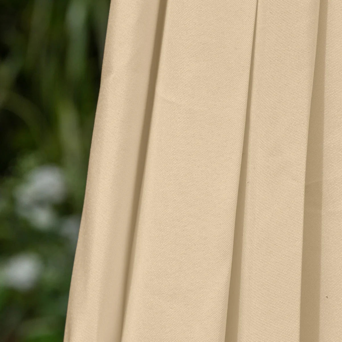 Beige 2.7m LED tilt parasol showcasing textured fabric, elegant draping, and a sturdy pole, ideal for outdoor shade and ambiance
