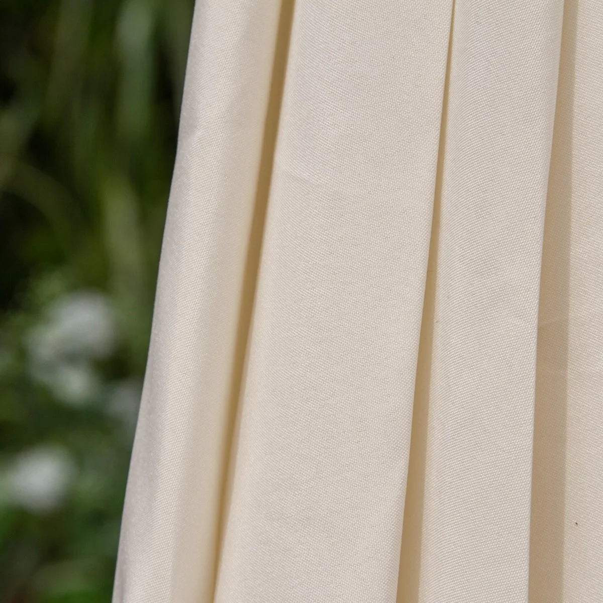 Cream 2.7m LED tilt parasol fabric close-up, showcasing smooth texture and soft cream color, ideal for outdoor shade and style