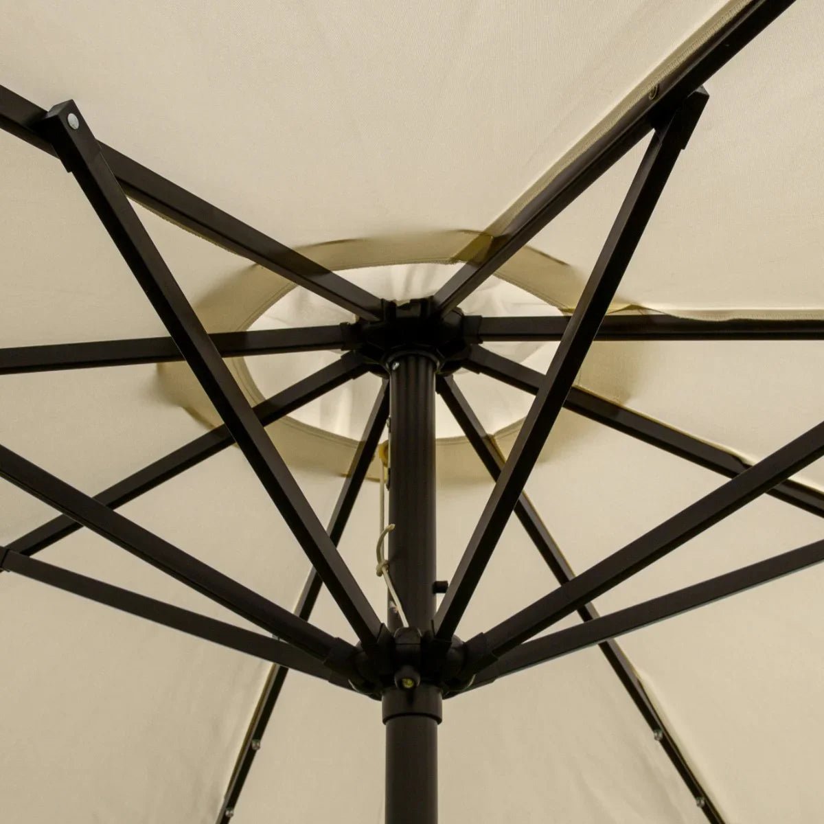 Cream 2.7m LED tilt parasol showcasing a sturdy black metal frame and a spacious, light cream canopy with a central hub design