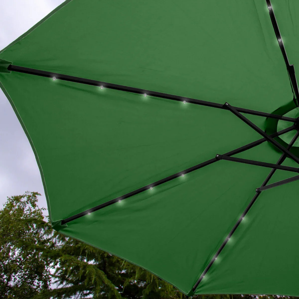 Green 2.7m LED tilt parasol with a vibrant canopy, featuring integrated lights and a sturdy black frame, perfect for outdoor settings