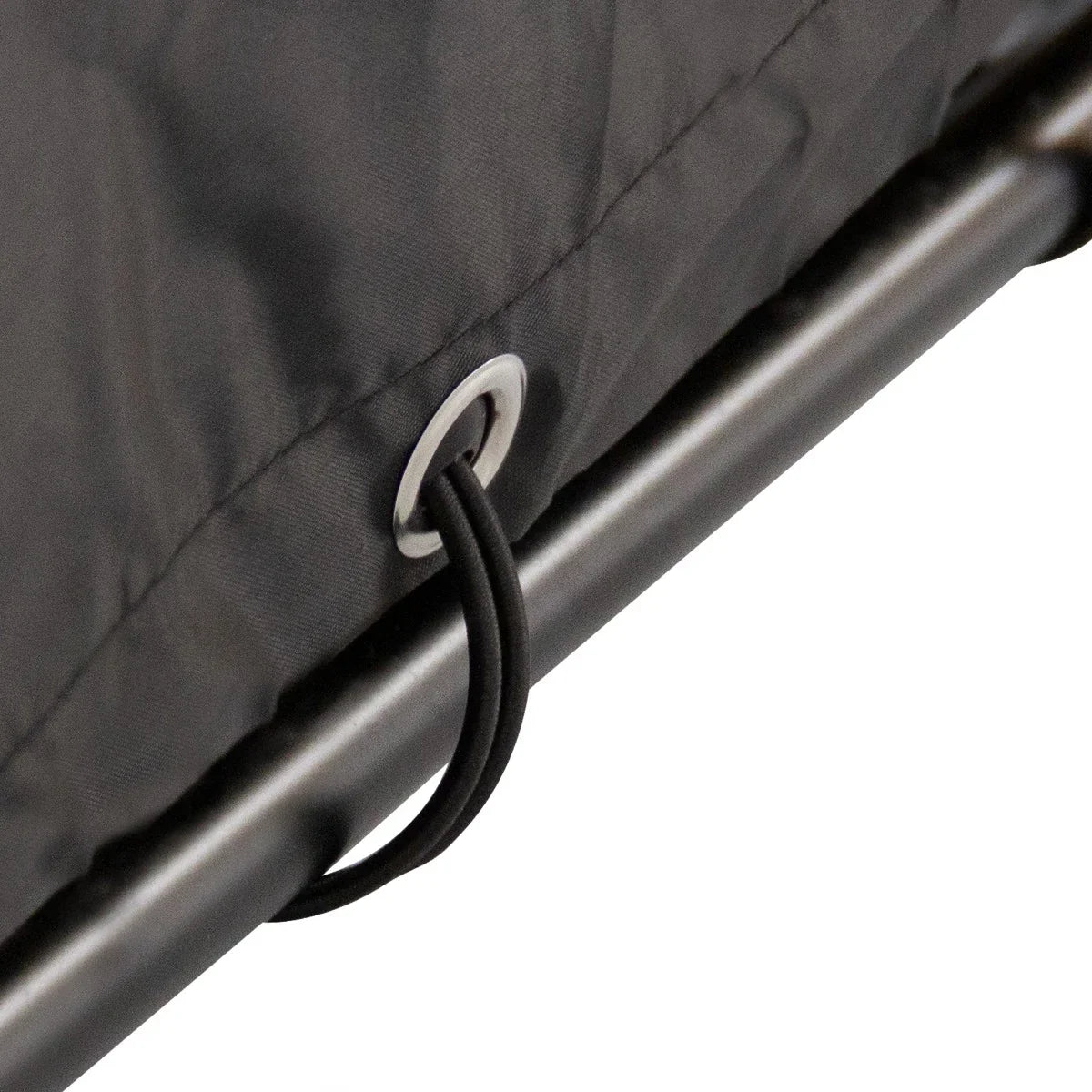 Durable gray fabric of a large bike tent showcasing reinforced grommet and elastic cord for secure setup and stability