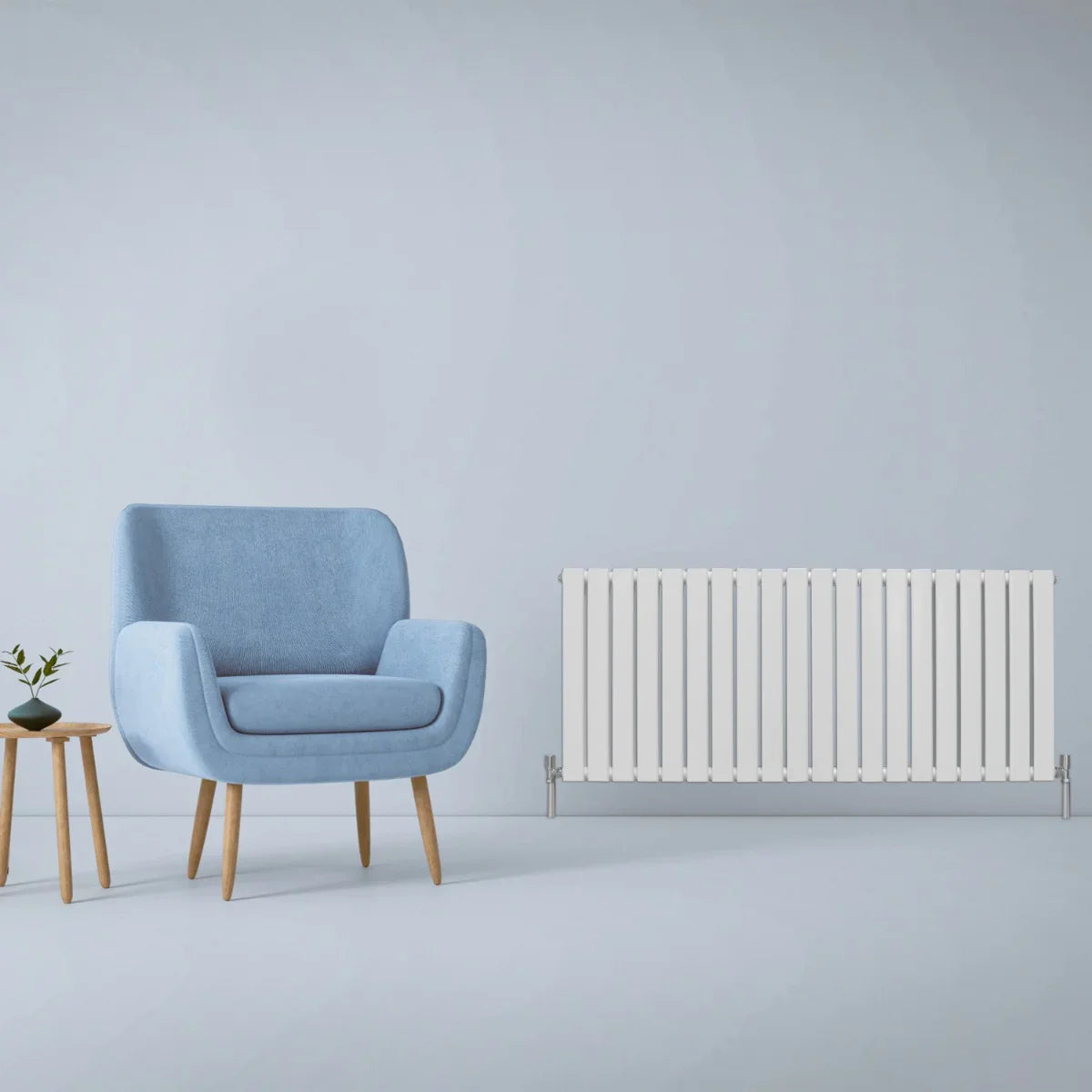 Gloss white designer flat panel radiator, 600mm x 1400mm, sleek rectangular shape, modern design, complements blue armchair and wooden table