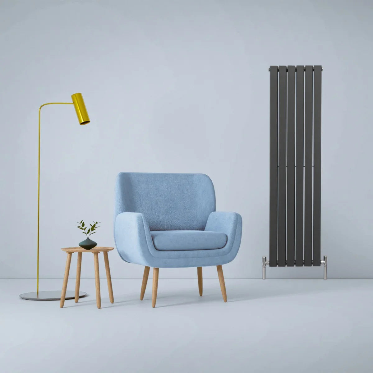 Designer flat panel radiator in anthracite grey, 1600mm x 420mm, sleek vertical design, complements modern decor with a cozy chair and lamp