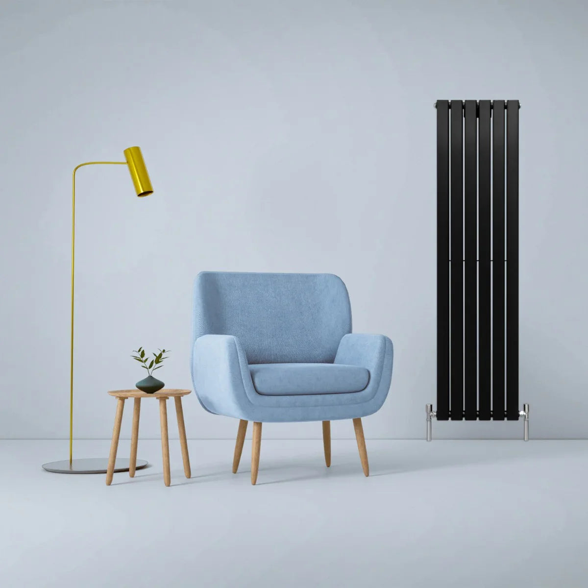 Matt black designer flat panel radiator, 1600mm x 420mm, sleek vertical design, complements modern decor with a cozy blue armchair and stylish lamp