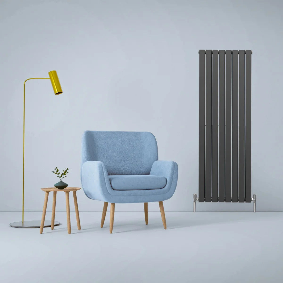 Designer flat panel radiator in anthracite grey, 1600mm x 560mm, sleek vertical design beside modern blue armchair and yellow lamp