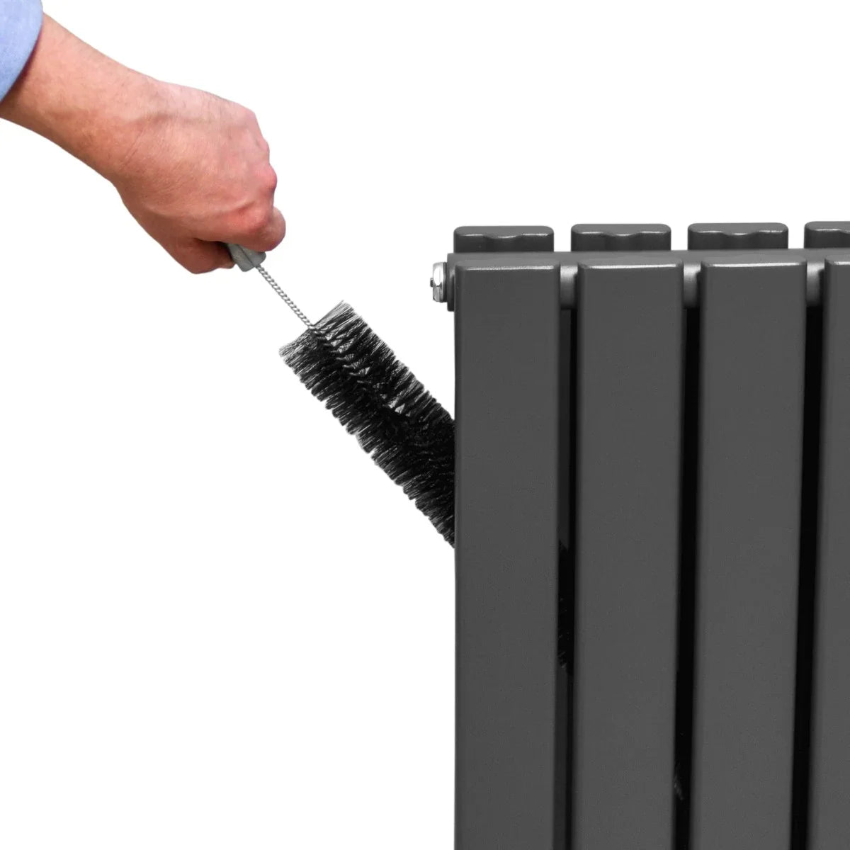 Anthracite grey designer flat panel radiator being cleaned with a brush, showcasing its sleek, modern design and smooth texture
