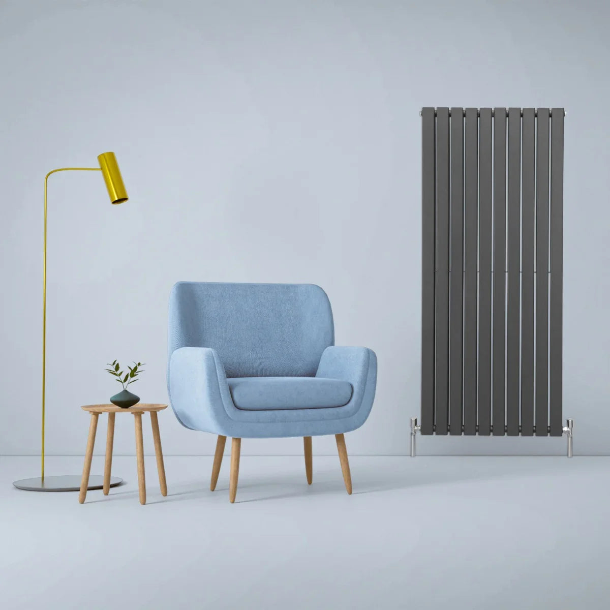 Designer flat panel radiator in anthracite grey, 1600mm x 700mm, sleek vertical design complements modern decor with a cozy chair and lamp