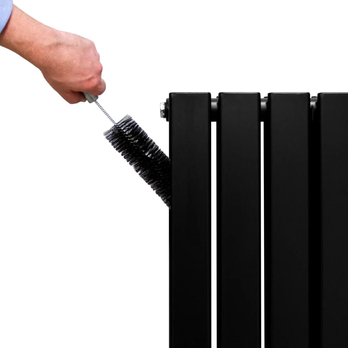 Matt black designer flat panel radiator with a hand using a brush for cleaning, showcasing sleek lines and modern design