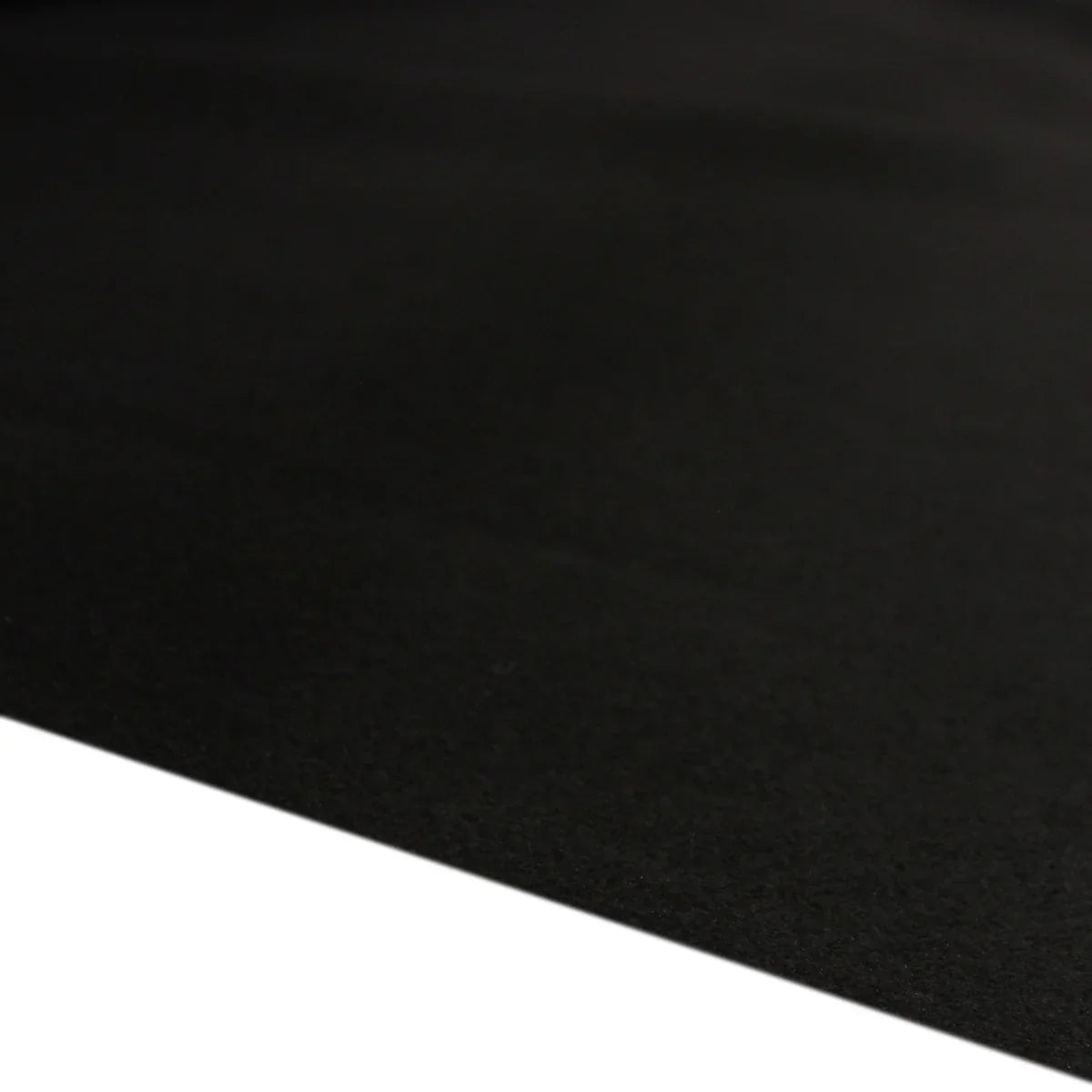 Black van carpet lining with a smooth, durable texture, ideal for vehicle interiors and custom installations