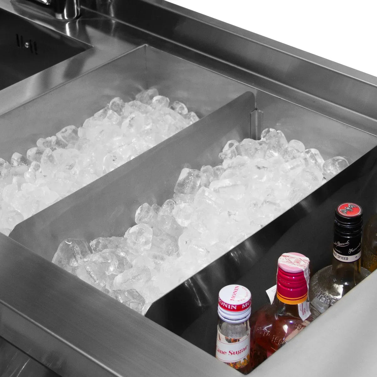 Stainless steel cocktail bar station with two compartments filled with ice and various liquor bottles for easy access