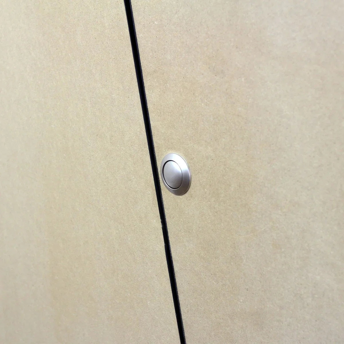Close-up of the MDF Camper Van Kitchen Unit LHD showing a sleek, modern handle on a smooth, light-colored surface