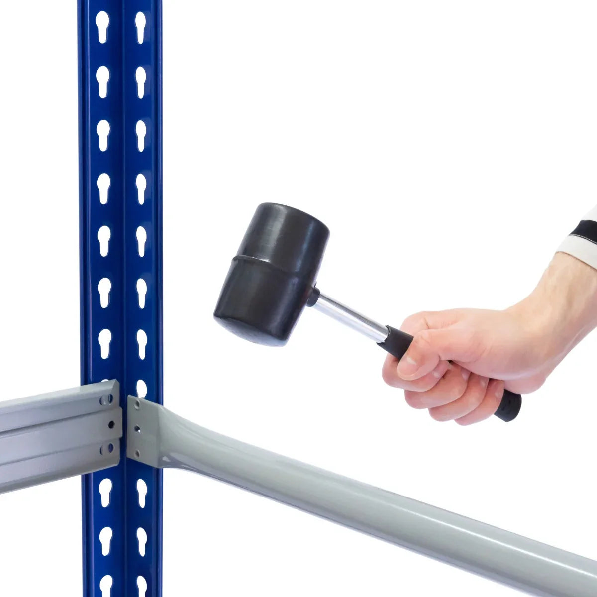 T-Rax Tyre Racking Bay assembly with a hand holding a rubber mallet, striking a metal frame in blue and silver finish