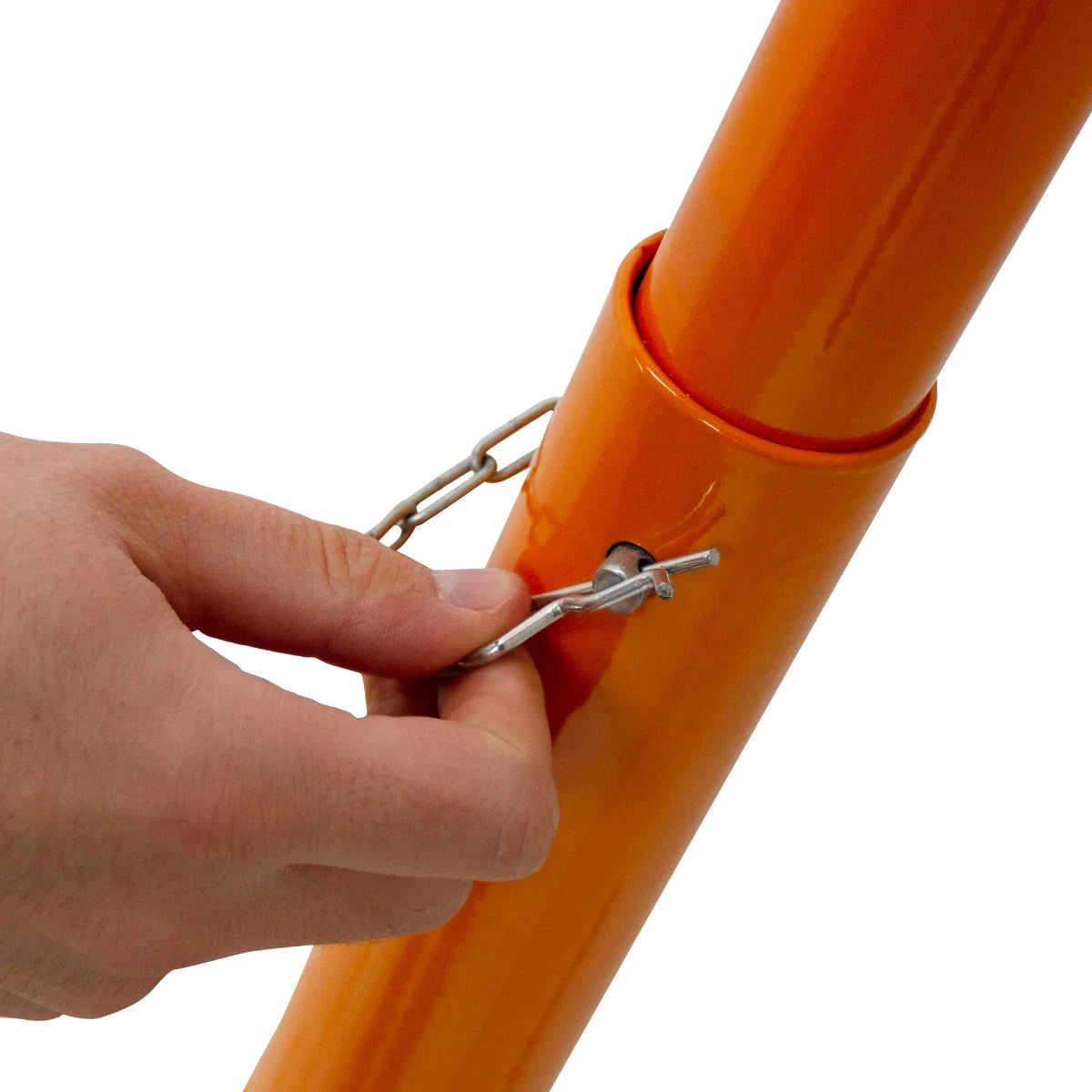 Close-up of a hand securing a pin on the T-Mech 330mm Block Splitter's bright orange metal frame, showcasing its sturdy design and functionality